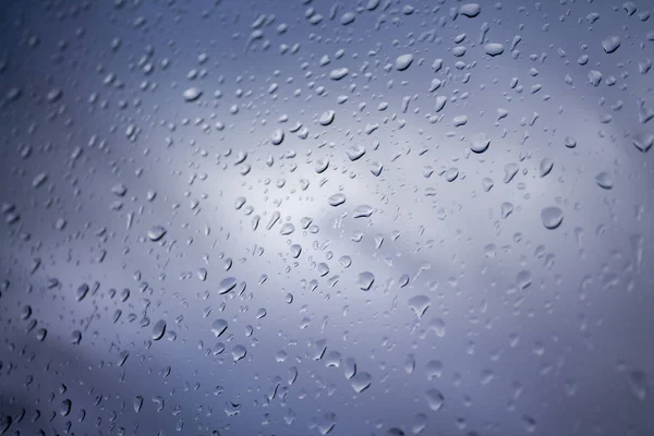 Drops of rain on glass , rain drops on clear window