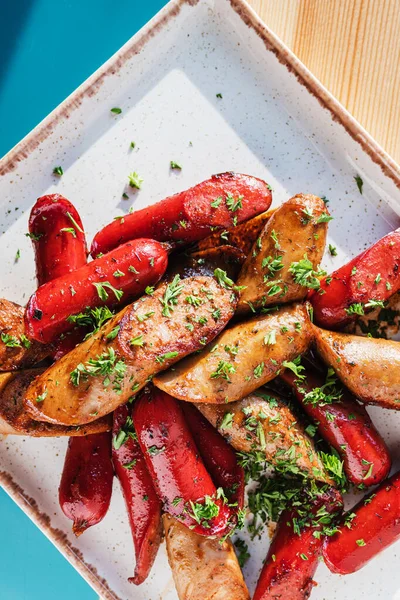 Barbecue meat sausages grilled on a white square plat — Stock Image Barbecue Meat Sausages Grilled White Square Plat Royalty Free Stock Images