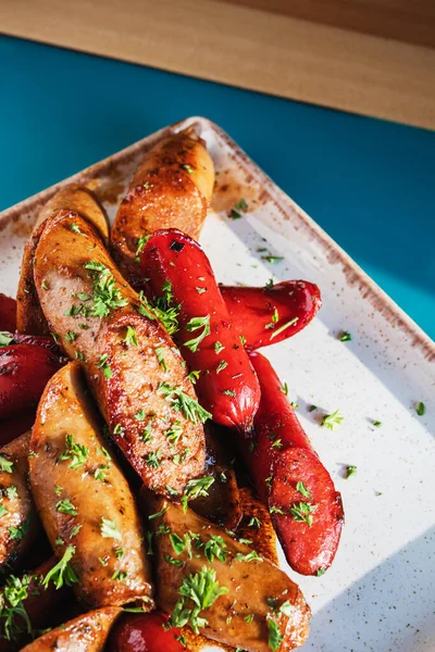 Barbecue meat sausages grilled on a white square plat — Stock Image Barbecue Meat Sausages Grilled White Square Plat Royalty Free Stock Photos