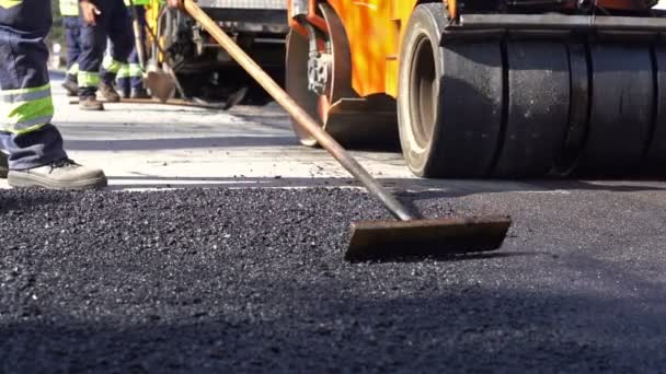 Road Construction Repairing Works Slow Motion Worker Using Asphalt Lute — Stock Video