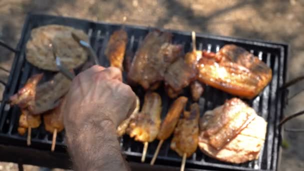 Hand Using Tongs Turning Meat Grill Rack Focus Juicy Slices — Stock Video