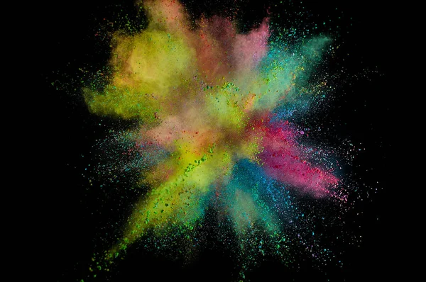 Colored powder explosion. Abstract closeup dust on backdrop. Col