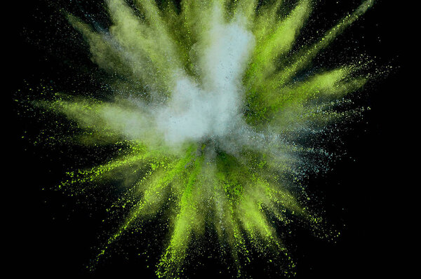 Colored powder explosion. Abstract closeup dust on backdrop. Col