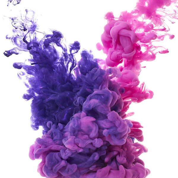 Ink in water. Splash paint mixing. Multicolored liquid dye. Abstract sculpture background color