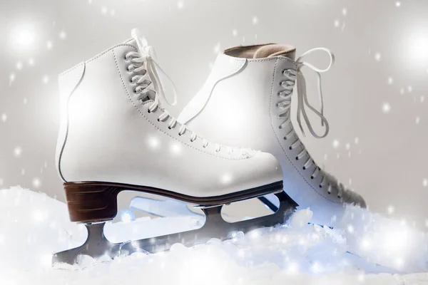 white figure skates on blocks of ice in the studio settings