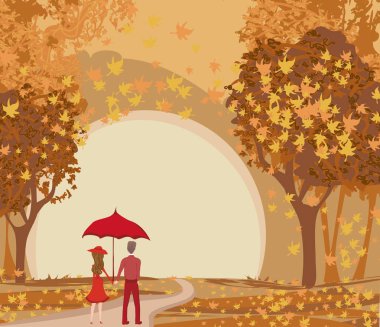 bir sonbahar yürüyüşünde romantik çift