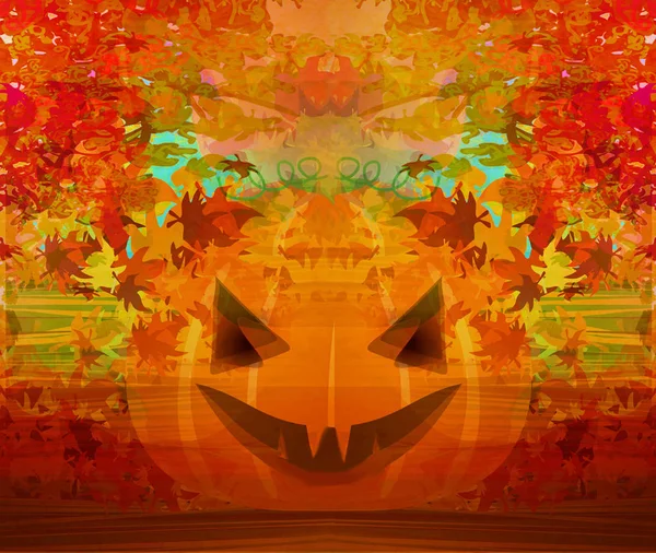 Страшний гарбуз на Хеллоуїн з листям — стокове фото
