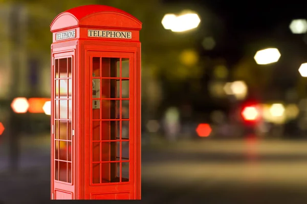 Teléfono rojo en la calle nocturna fondo borroso. Rin 3D — Foto de Stock