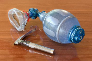 Laringoskop ve Ambu Torbası, ahşap masada havalandırma resüsitasyonu için, 3 boyutlu görüntüleme.