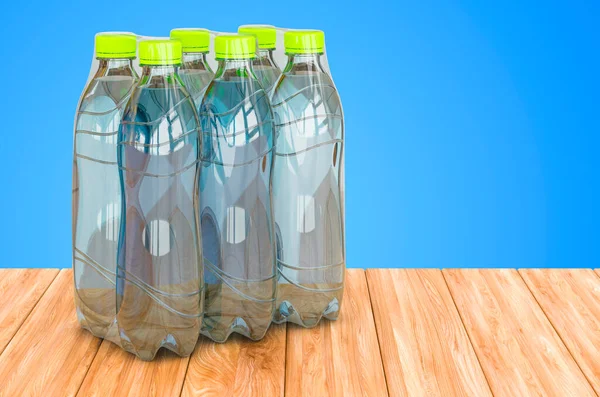 Бутылки Водой Завернутые Термоусадочную Пленку Деревянном Столе Рендеринг — стоковое фото