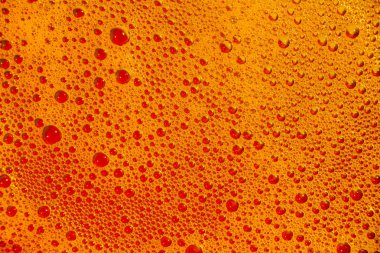 Arka plan veya doku olarak güzel sarı-turuncu kabarcıklar