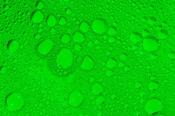 Texture of green soap bubbles as a background