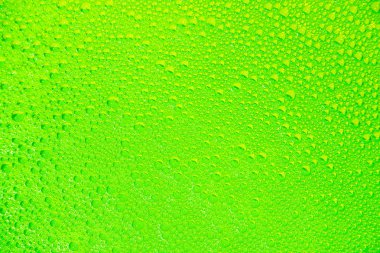 Arka plan ve doku olarak yeşil sarı sabun köpüğü.