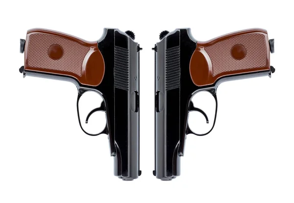 Two pistols symmetrically directed down the trunks — Stock Photo, Image