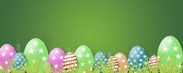 Wielkanoc Banner - kolorowy malowane jajka rzędu na trawie — Zdjęcie stockowe