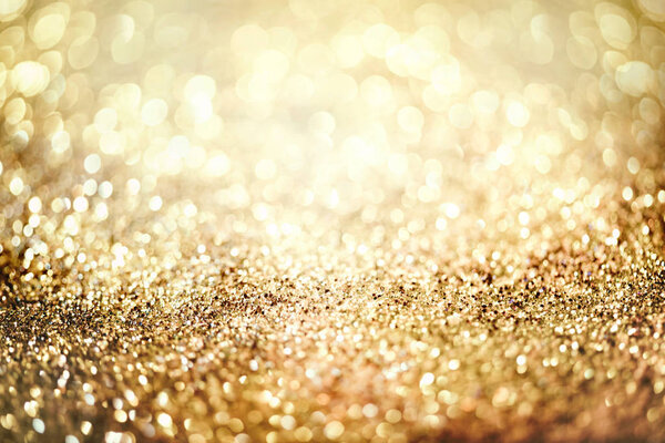 glitter gold bokeh Colorfull Blurred abstract background for birthday, anniversary, wedding, new year eve or Christmas.