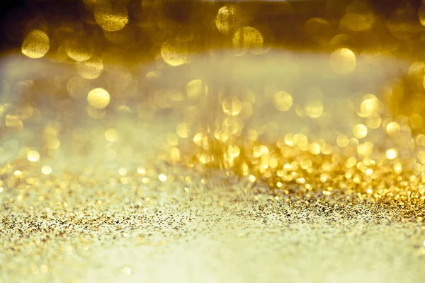 Dorato glitter bokeh texture di illuminazione offuscata backgroun astratto — Foto Stock