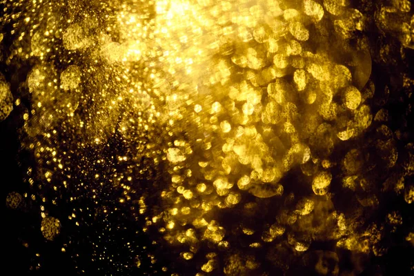 Guld glitter bokeh belysning struktur suddig abstrakt backgroun — Stockfoto