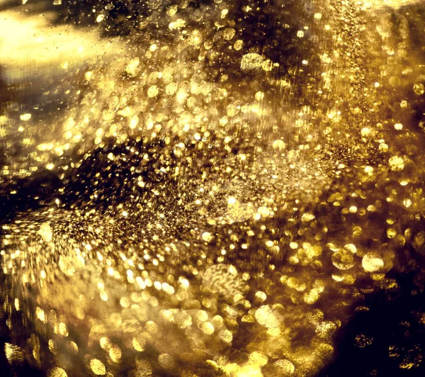 Brillo dorado bokeh textura de la iluminación fondos abstractos borrosos —  Fotos de Stock