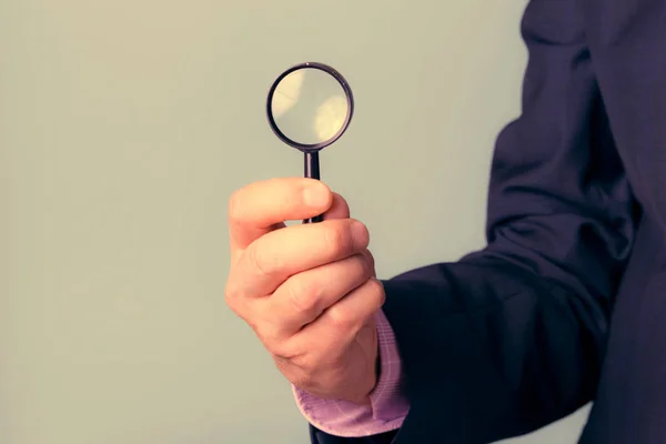 Man Holds Magnifying Glass His Hand Symbol Observing Trends — Stock Photo, Image