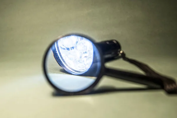 flashlight and magnifying glass