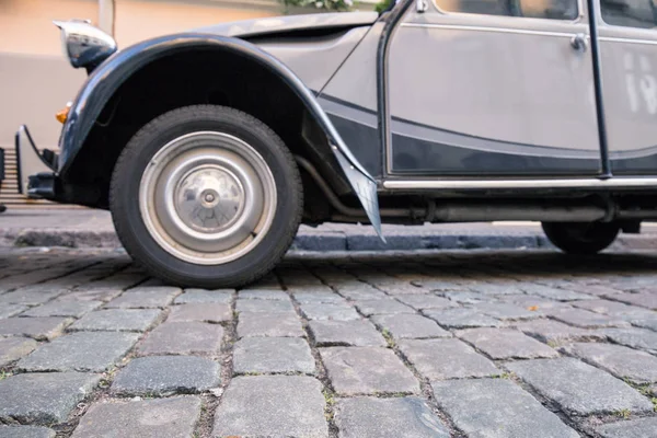 Retro car in the street tourist center.Cobblestone pavement in the historic center of Riga, Latvia.