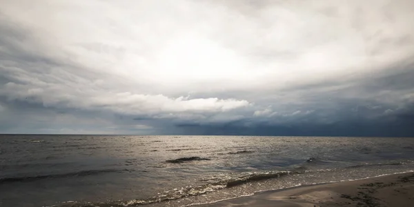 The beginning of the storm over the Baltic Sea. Storm clouds over the water.