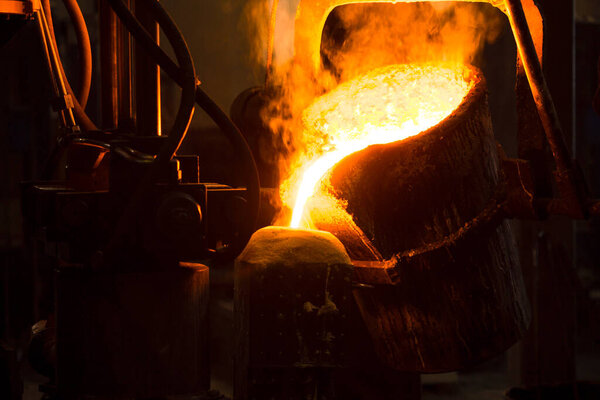 Melting furnace and factory equipment for cast iron and steel. The molten liquid metal is poured into the mold.