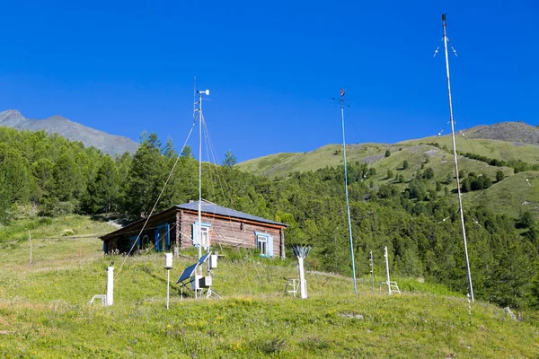 The weather station building for weather forecasting in high mountains of Russia. Weather station for monitoring the weather in the mountains.