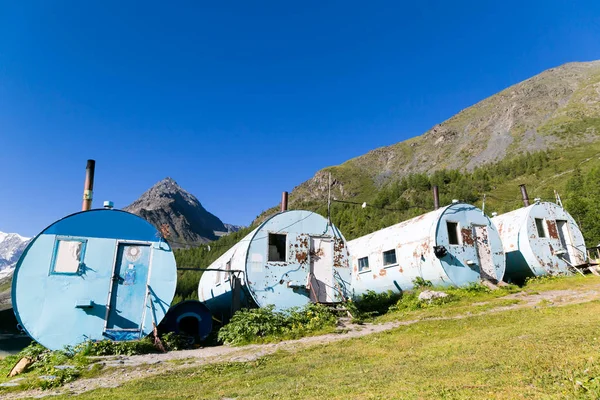 Recreation center for climbers in the mountains. Large barrels of tank capacity house of tourists in mountain hikes.