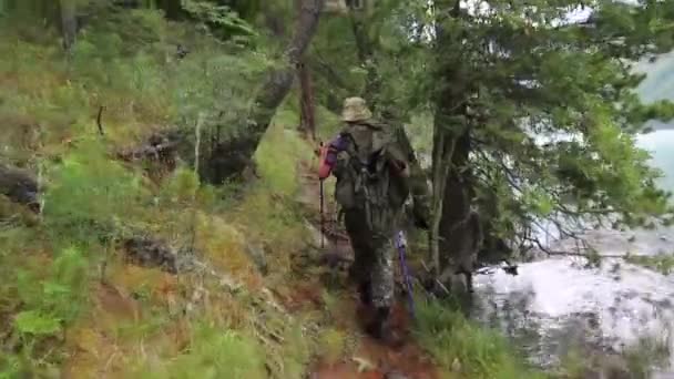 Man Backpack Walks Mountain River Tourist Large Bag His Back — Stock Video