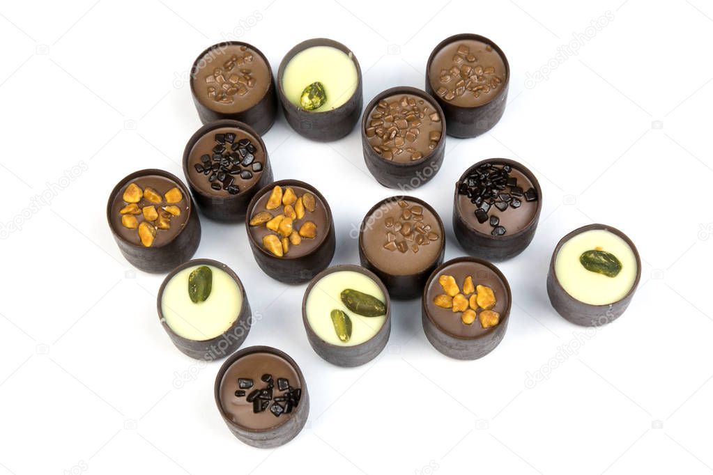 Chocolates on a white background. Isolate Beautiful sweet candies with different fillings on a white background.