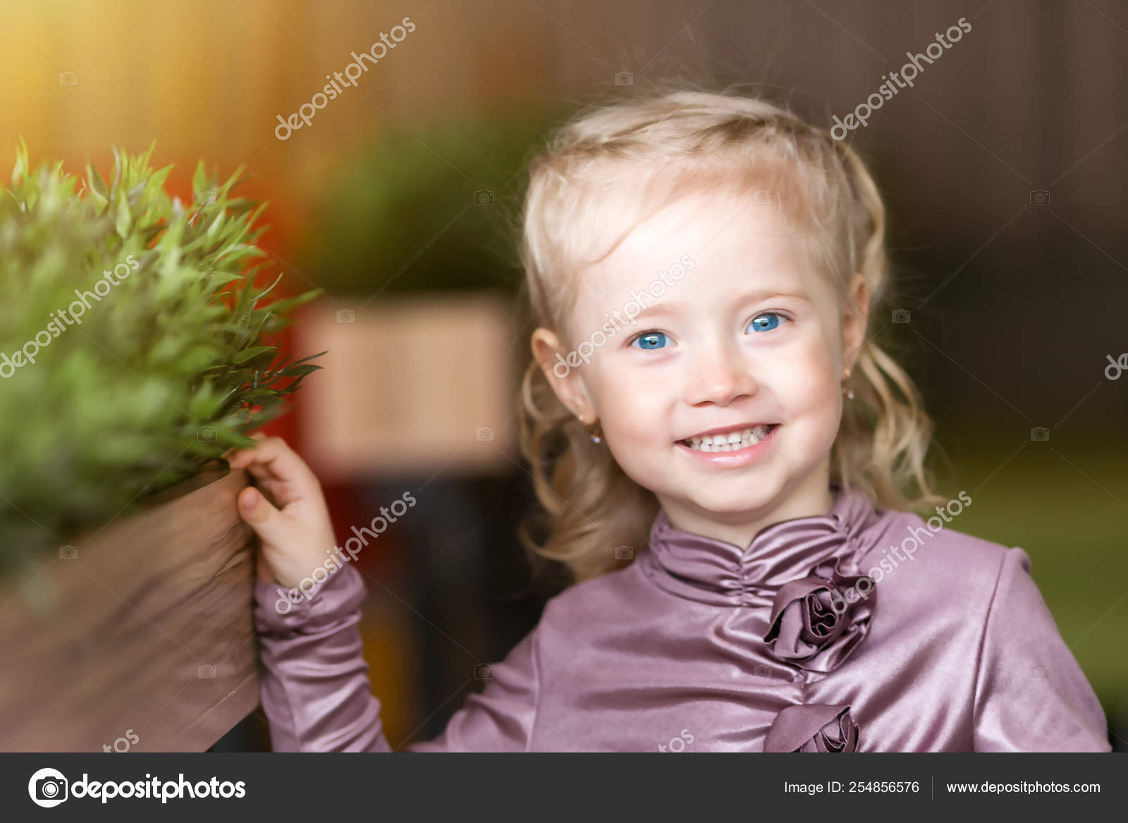 Little Girl Blonde Blue Eyes Flower Bed Green Grass Stock Photo