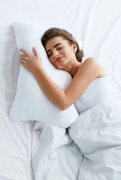 Healthy Sleep. Woman Sleeping On White Bedding, WIth Soft Pillow, Mattress With Blanket. High Resolution.