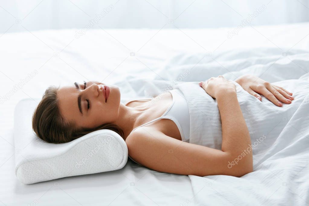 Healthy Sleep. Woman Sleeping On White Orthopedic Pillow In Bed. High Resolution.