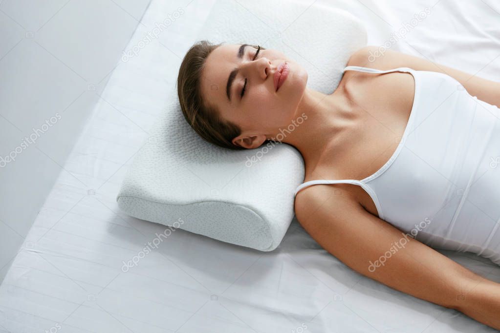 Healthy Sleep. Woman Sleeping On White Orthopedic Pillow In Bed. High Resolution.