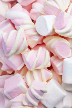 Arka plan üzerinde Marshmallows şekerler. Hatmi tatlılar natürmort kadar kapatın. Yüksek çözünürlük