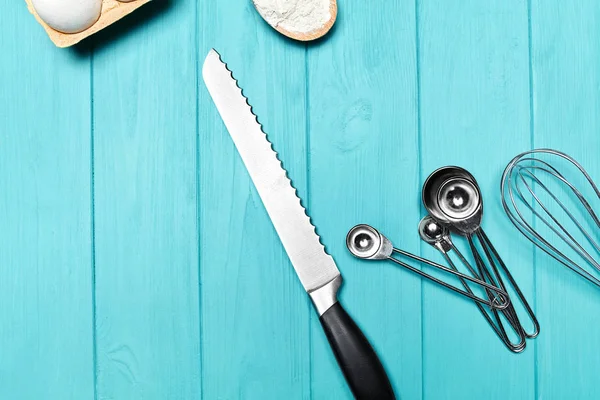 Baking Tools On Blue Table. Various Kitchen Equipment On Blue Background. High Resolution