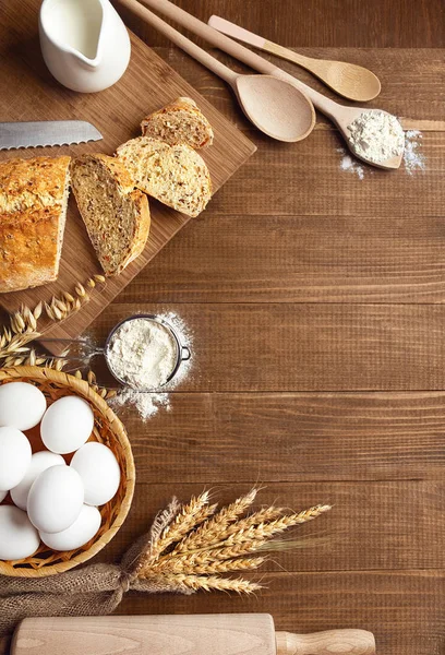 Baking Bread. Close Up Of Baking Ingredients And Products On Wood Table Still Life. High Resolution