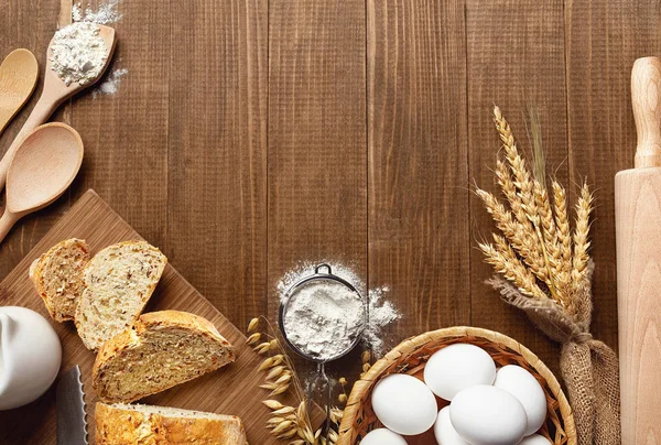 Baking Bread. Close Up Of Baking Ingredients And Products On Wood Table Still Life. High Resolution