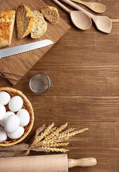 Baking Bread. Close Up Of Baking Ingredients And Products On Wood Table Still Life. High Resolution