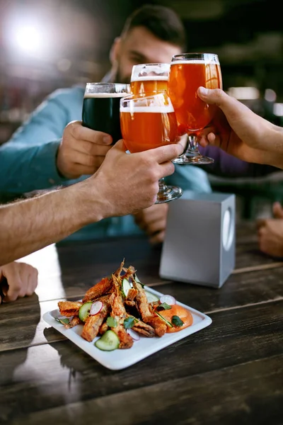 Drinking Beer Friends Raising Glasses Beer Table Food Pub Bar — Stock Photo, Image