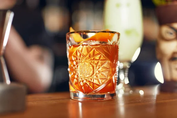 Cocktail Drink In Bar Close Up. Old Fashioned Cocktail With Orange Peel Garnish Bar Counter. High Resolution