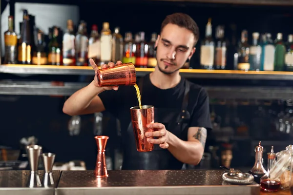Cocktail Bar. Bartender Making Cocktails At Bar Counter. Barman Preparing Drink, Pouring Spirits In Shaker. High Resolution
