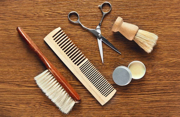 Barber Tools On Wooden Background. Closeup Of Vintage Barber Equipment And Supplies On Wood Table. High Resolution