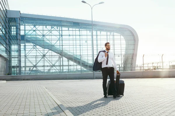 Business Man Travel On Business Trip. Handsome Man In Suit With Suitcase Going To Airport. High Resolution