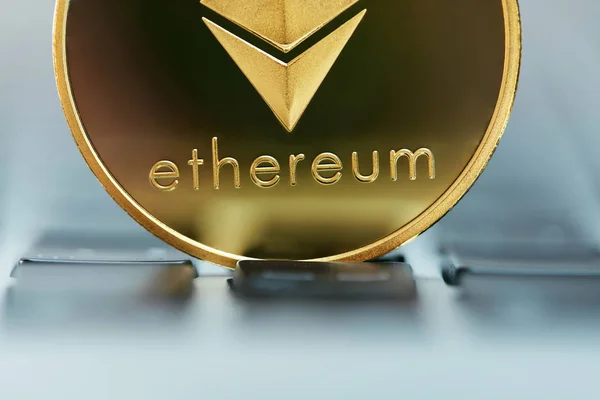 Ethereum Coin Virtual Currency Close Up. Gold Cryptocurrency Coin. High Resolution