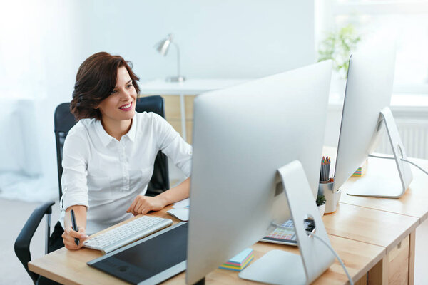 Woman Working On Project On Computer In Office. Female Designer Working On Digital Drawing Tablet. High Resolution