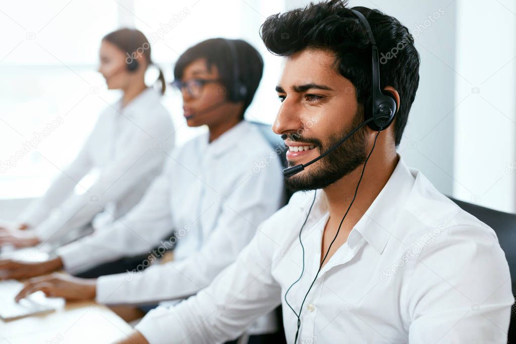 Operators Working On Hotline In Call-Center. Man Consulting Customers Online In Client Support Center. High Resolution