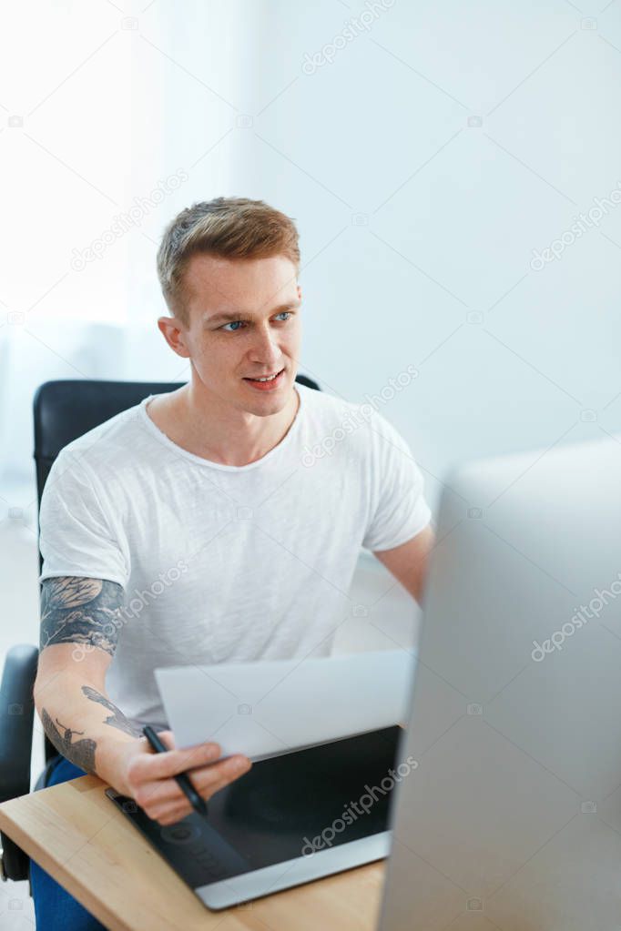 Man Working On Computer In Office. Male Web Designer Working On Design Project, Creating Webdesign. High Resolution